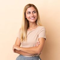 blonde-uruguayan-girl-isolated-beige-background-happy-smiling.jpg